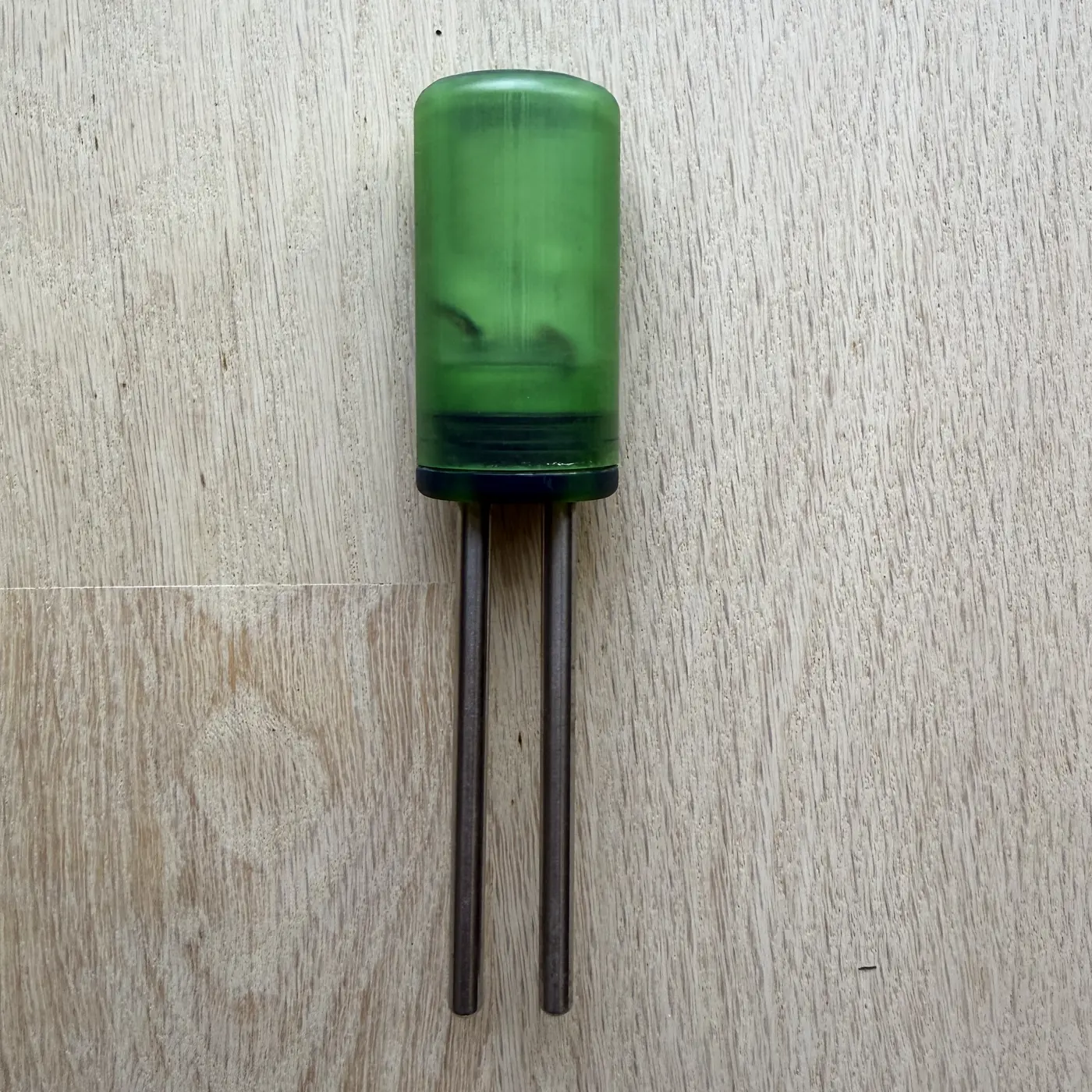 A finished PlantSense sensor in its translucent green shell